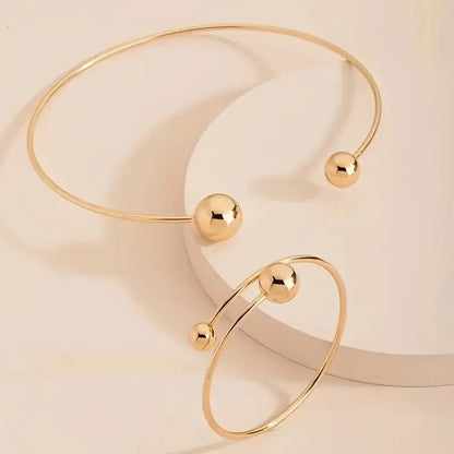 Minimalistische glansset met halsbandketting en open armband | Goud