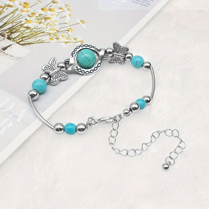 Oasis armband met zwevende vlinder | Witgoud