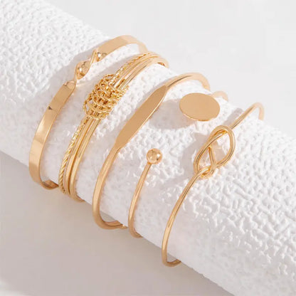 Elegante armbandenset met knoopmotief | Goud