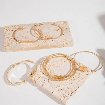 Elegante armbandenset met knoopmotief | Goud