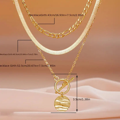 Savira gelaagde ketting met getextureerde munt | Goud