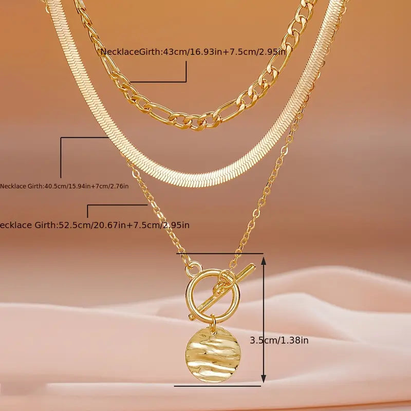 Savira gelaagde ketting met getextureerde munt | Goud