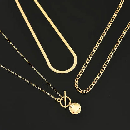 Savira gelaagde ketting met getextureerde munt | Goud