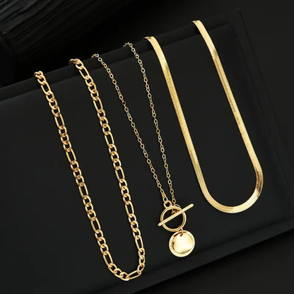 Savira gelaagde ketting met getextureerde munt | Goud