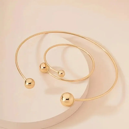 Minimalistische glansset met halsbandketting en open armband | Goud
