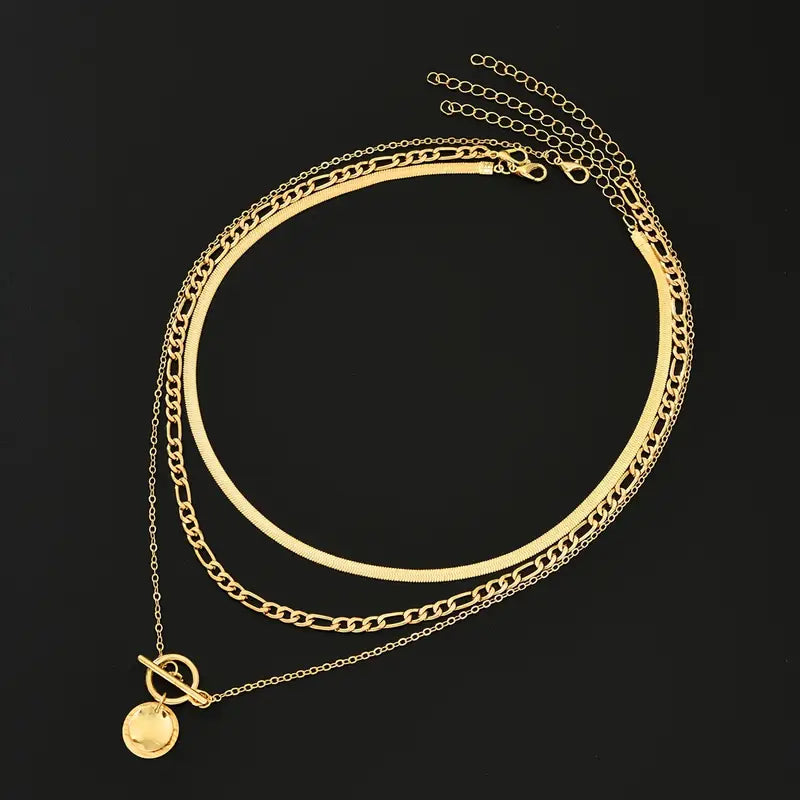 Savira gelaagde ketting met getextureerde munt | Goud