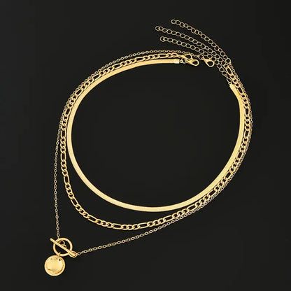 Savira gelaagde ketting met getextureerde munt | Goud