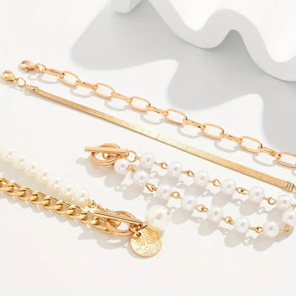 Chique gouden 4-delige armbandenset – slangenketting, parels en schakels | Goud