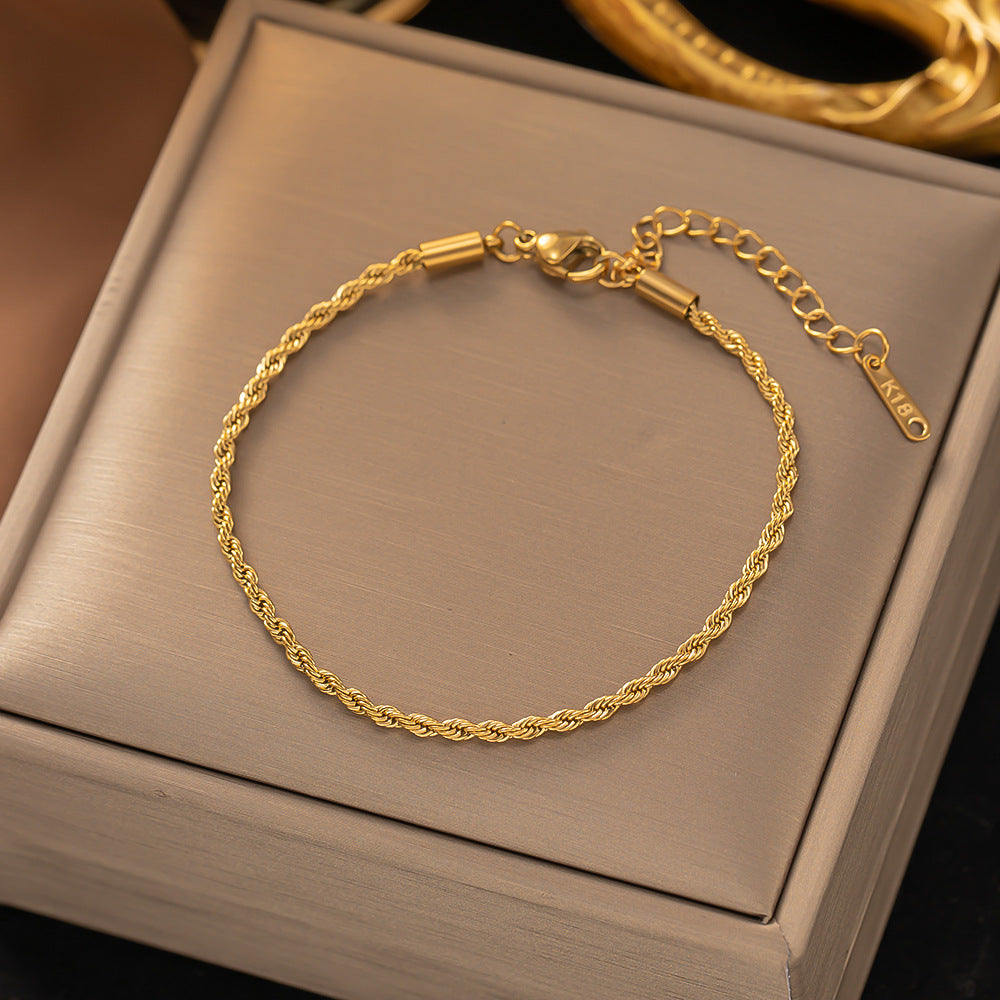 Gedraaide schakelarmband | Goud