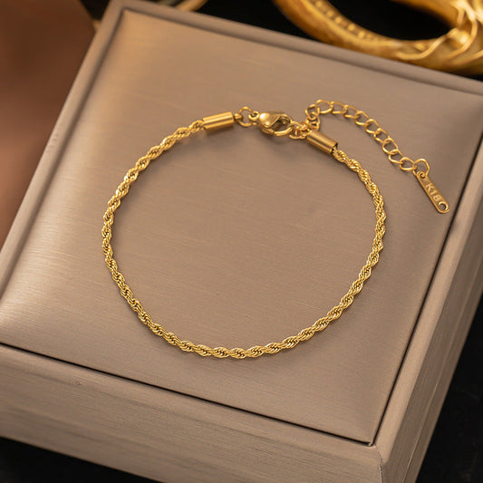 Gedraaide schakelarmband | Goud