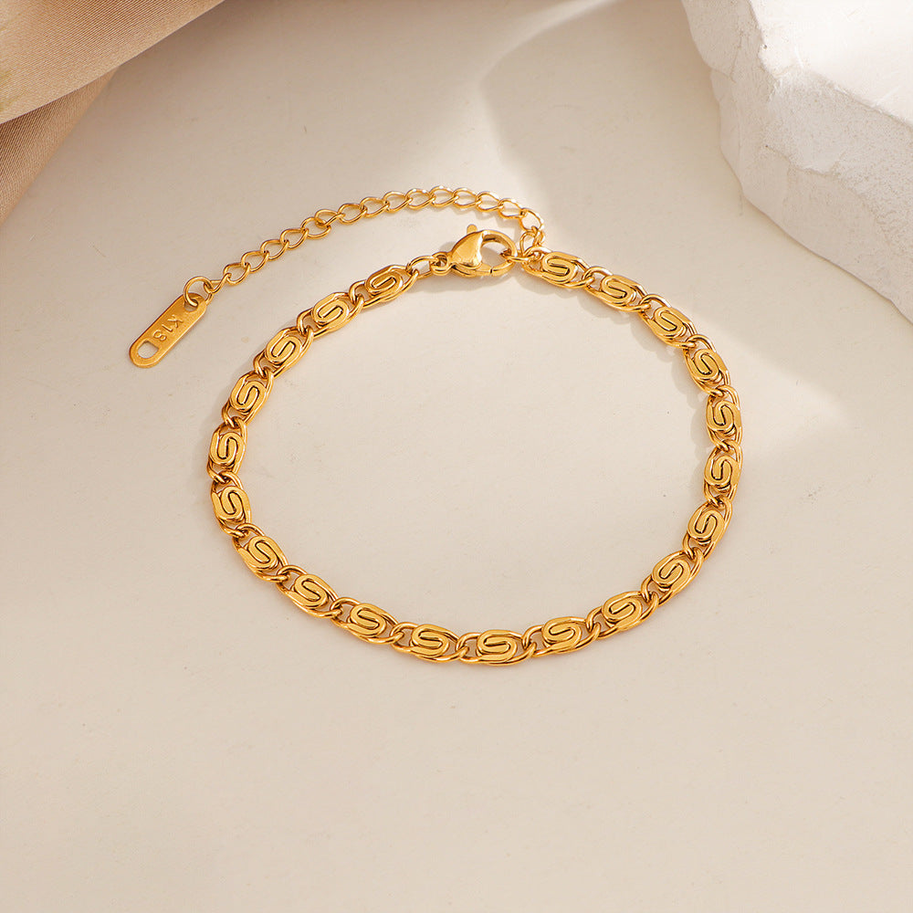 Nusa gevlochten schakelarmband | Goud