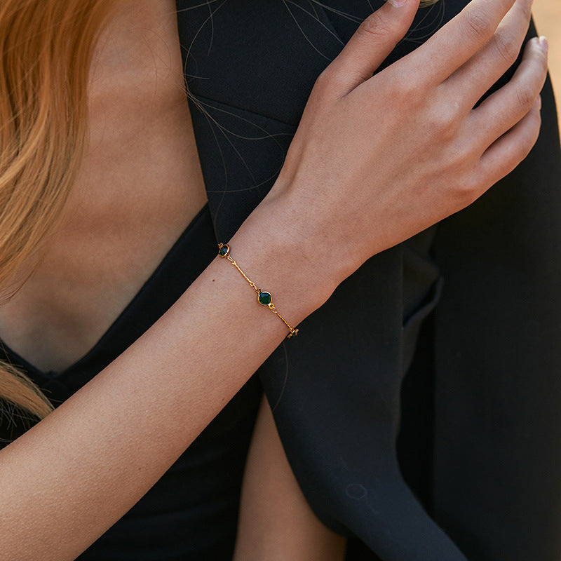 Schakelarmband met smaragd | Goud