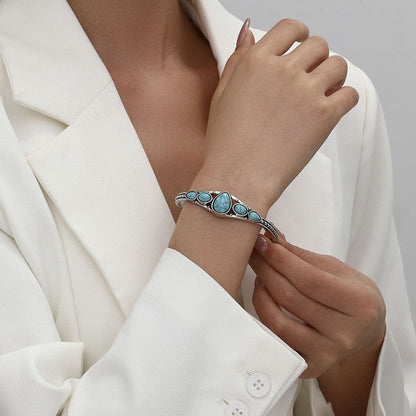 Open armband met turkooizen druppel | Witgoud