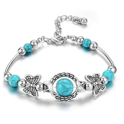 Oasis armband met zwevende vlinder | Witgoud