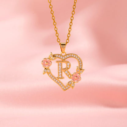 Ketting met initiaal en bloemenbedel | Goud