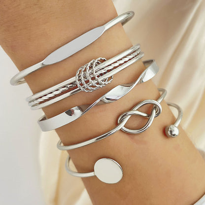 Elegante armbandenset met knoopmotief | Goud