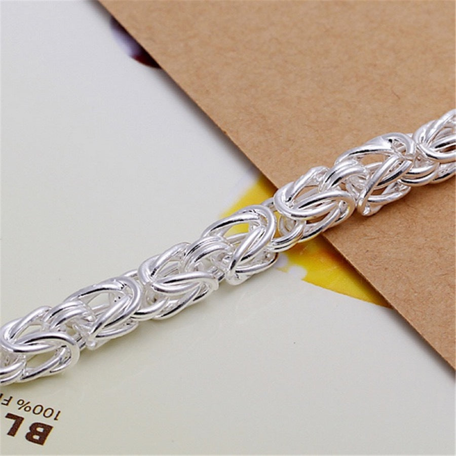 Maximus armband met koninklijk vlechtwerk | Witgoud