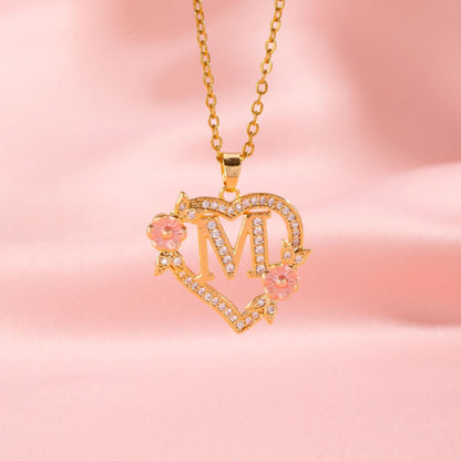 Ketting met initiaal en bloemenbedel | Goud