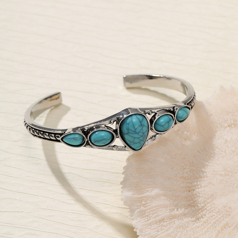Open armband met turkooizen druppel | Witgoud
