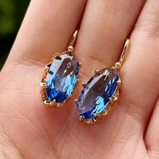 Gouden oorbellen met blauwe bloem | Goud