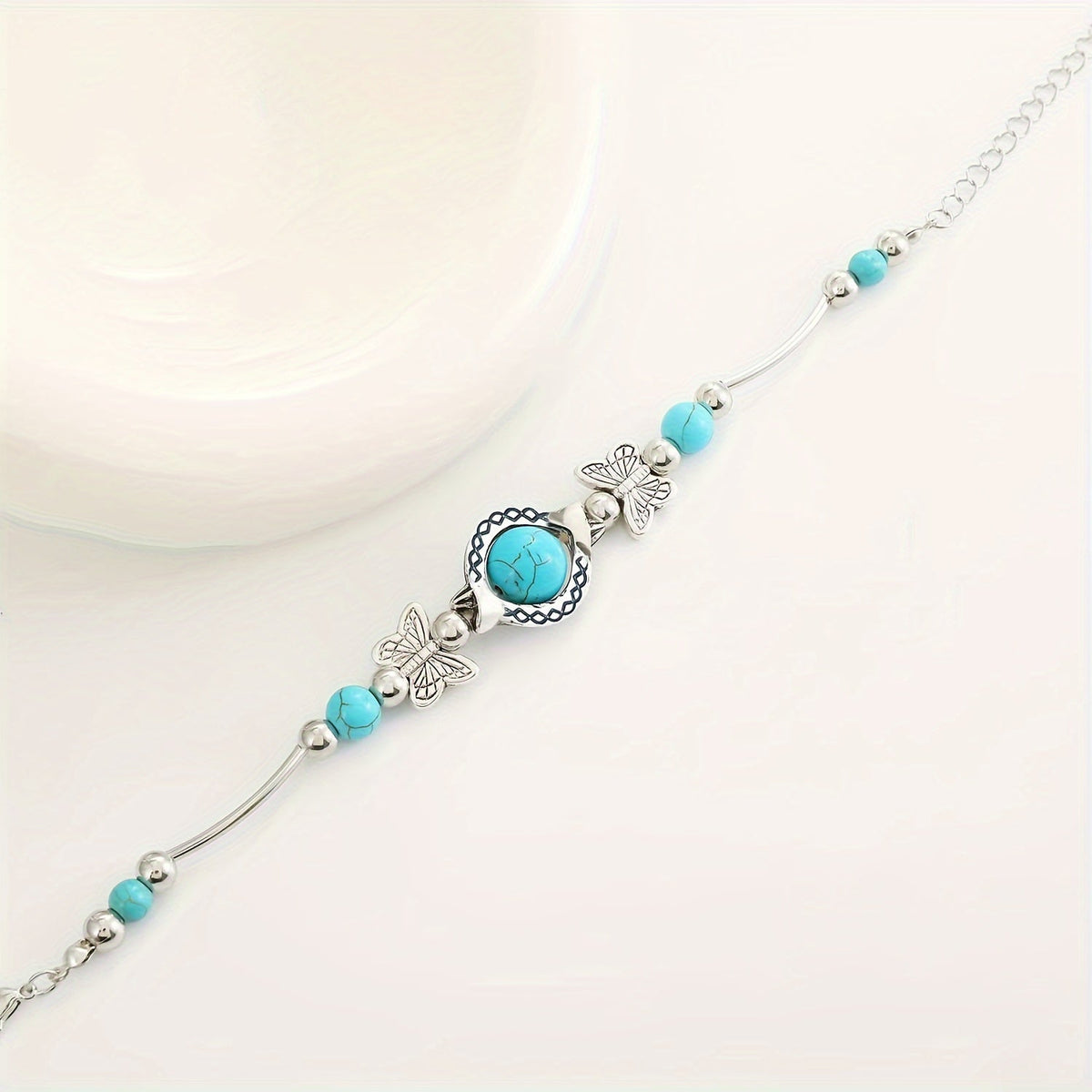 Oasis armband met zwevende vlinder | Witgoud