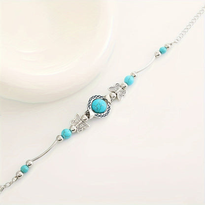 Oasis armband met zwevende vlinder | Witgoud