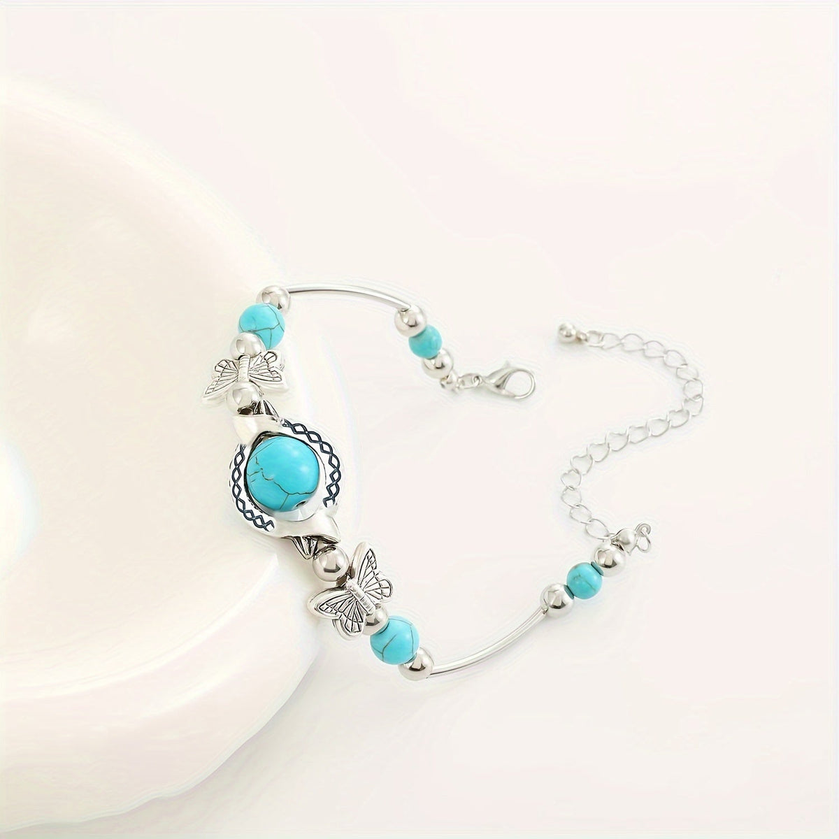 Oasis armband met zwevende vlinder | Witgoud