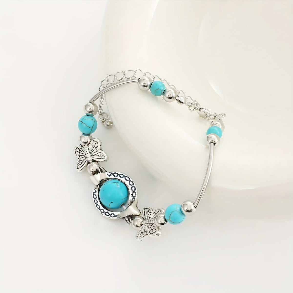 Oasis armband met zwevende vlinder | Witgoud