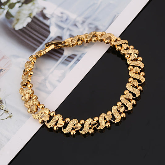 Lily armband met sierlijk golfmotief | Goud