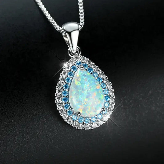Elegante sprankelende druppelketting met blauwe opaal | Witgoud