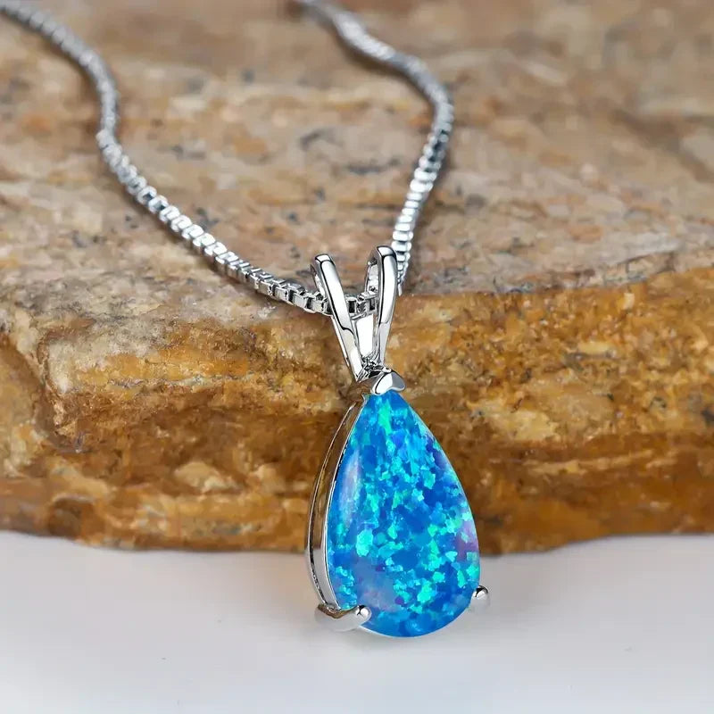 Druppelketting met azuurblauwe opaal | Witgoud