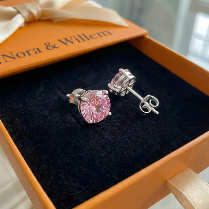 Ronde oorstekers met roze saffier | Witgoud